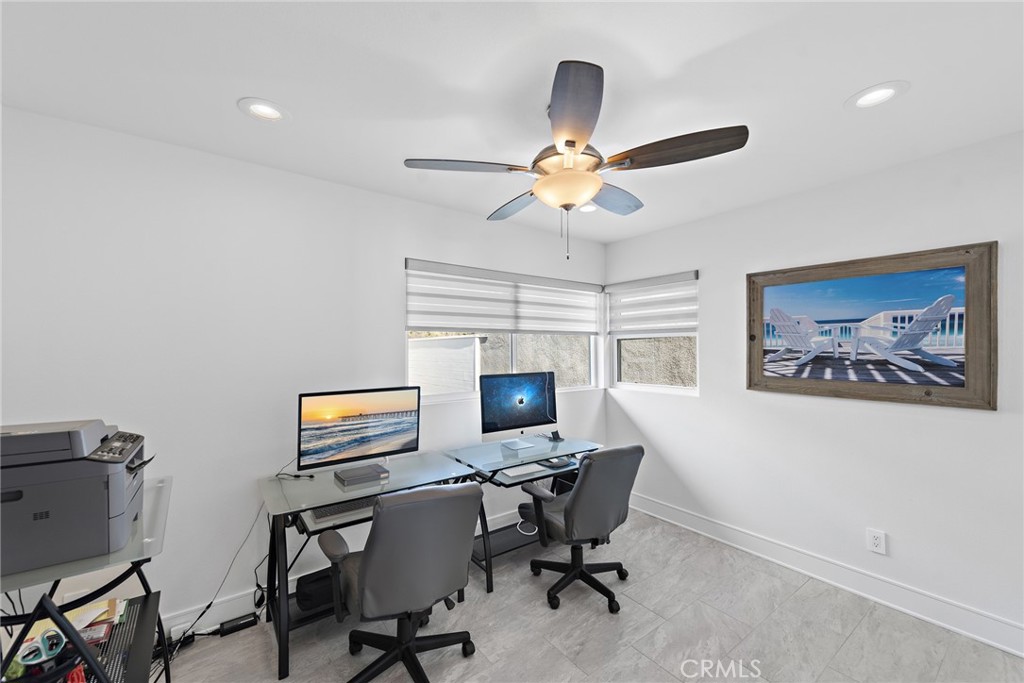 35585 Beach Road Dana Point, CA 92624 - Photo 34 of 43 a view of a workspace with furniture and a ceiling fan