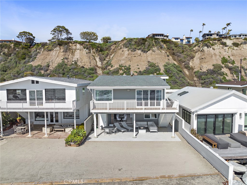 35585 Beach Road Dana Point, CA 92624 - Photo 37 of 43 a front view of a house with a mountain in the background
