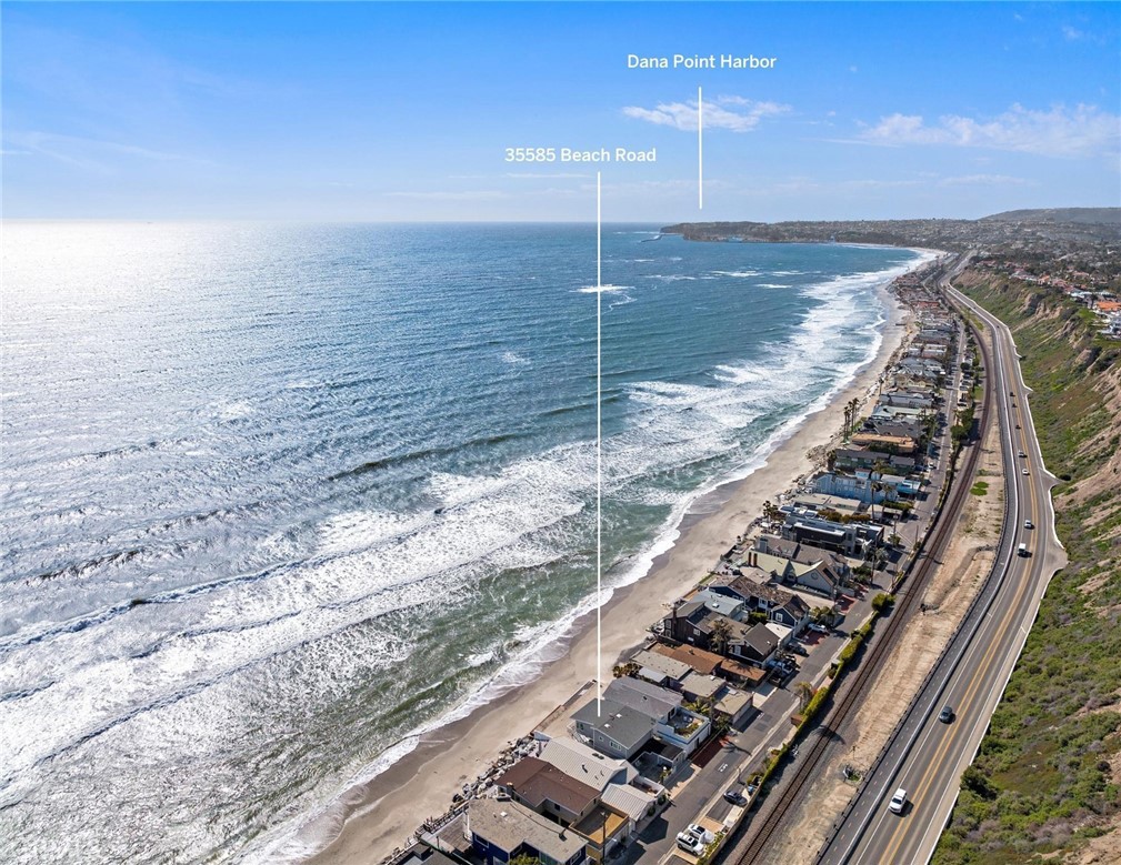 35585 Beach Road Dana Point, CA 92624 - Photo 5 of 43 a view of water heater room with wooden floor