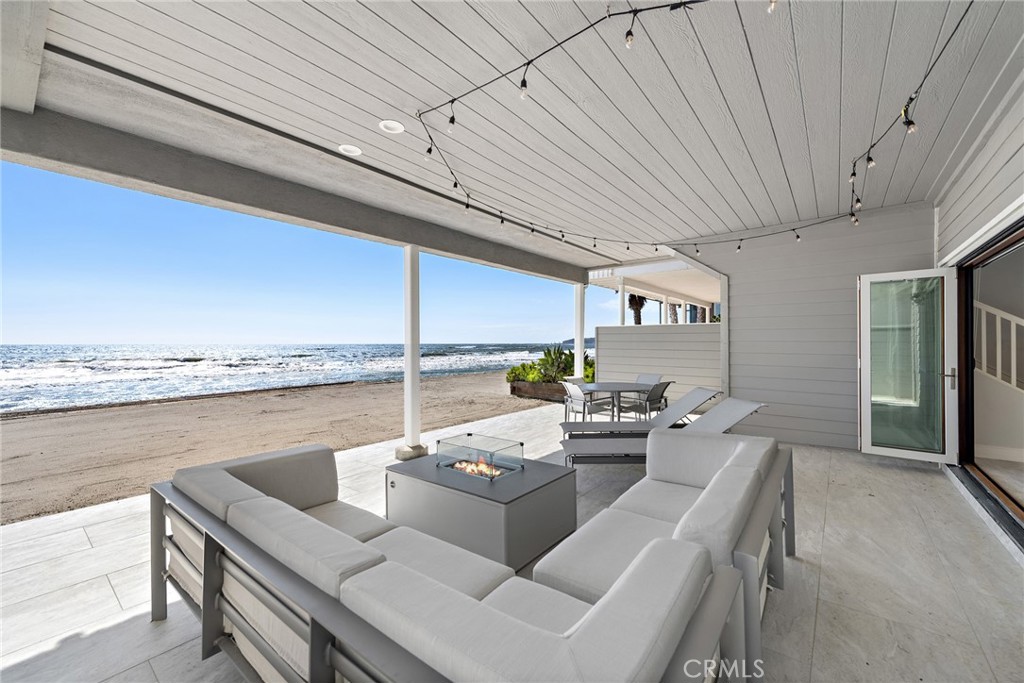 35585 Beach Road Dana Point, CA 92624 - Photo 6 of 43 a view of a patio with couches table and chairs