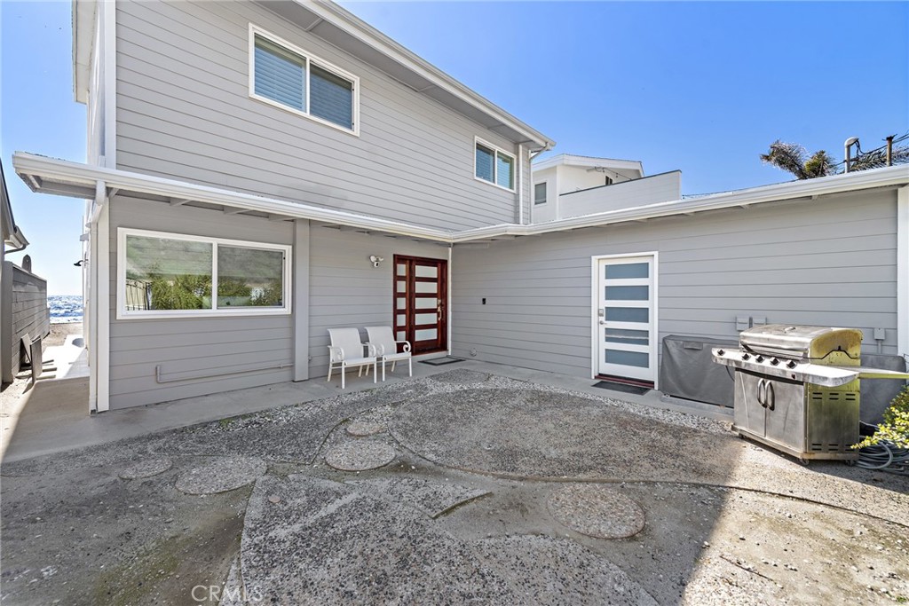 35585 Beach Road Dana Point, CA 92624 - Photo 8 of 43 a view of a house with a yard and garage