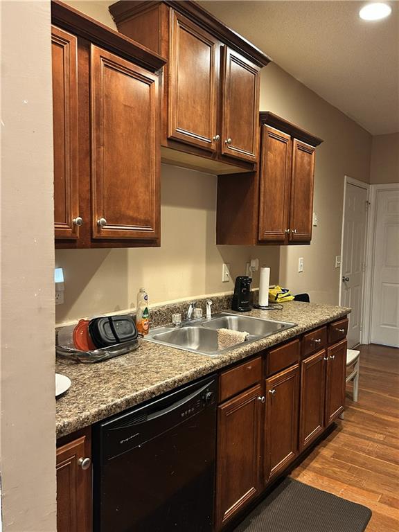 6354 Olmadison Place Atlanta, GA 30349 - Photo 3 of 8 a kitchen with granite countertop stainless steel appliances a sink window and cabinets