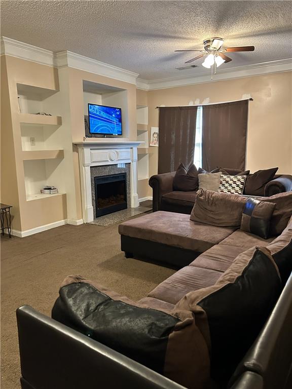 6354 Olmadison Place Atlanta, GA 30349 - Photo 5 of 8 a living room with furniture and a fireplace