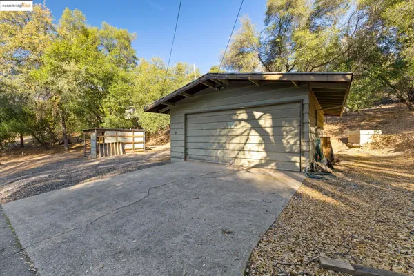 a view of a house with a yard and garage