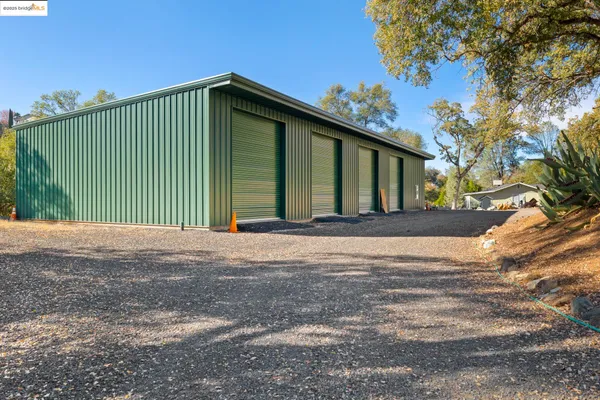 a view of a street with a bike and trees