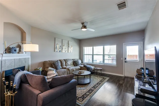 a living room with furniture and a fireplace