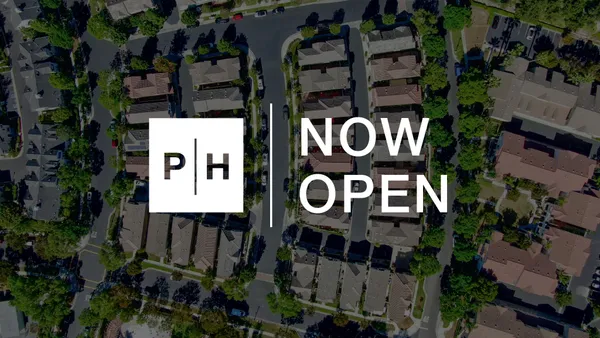 a sign on a pole on a street