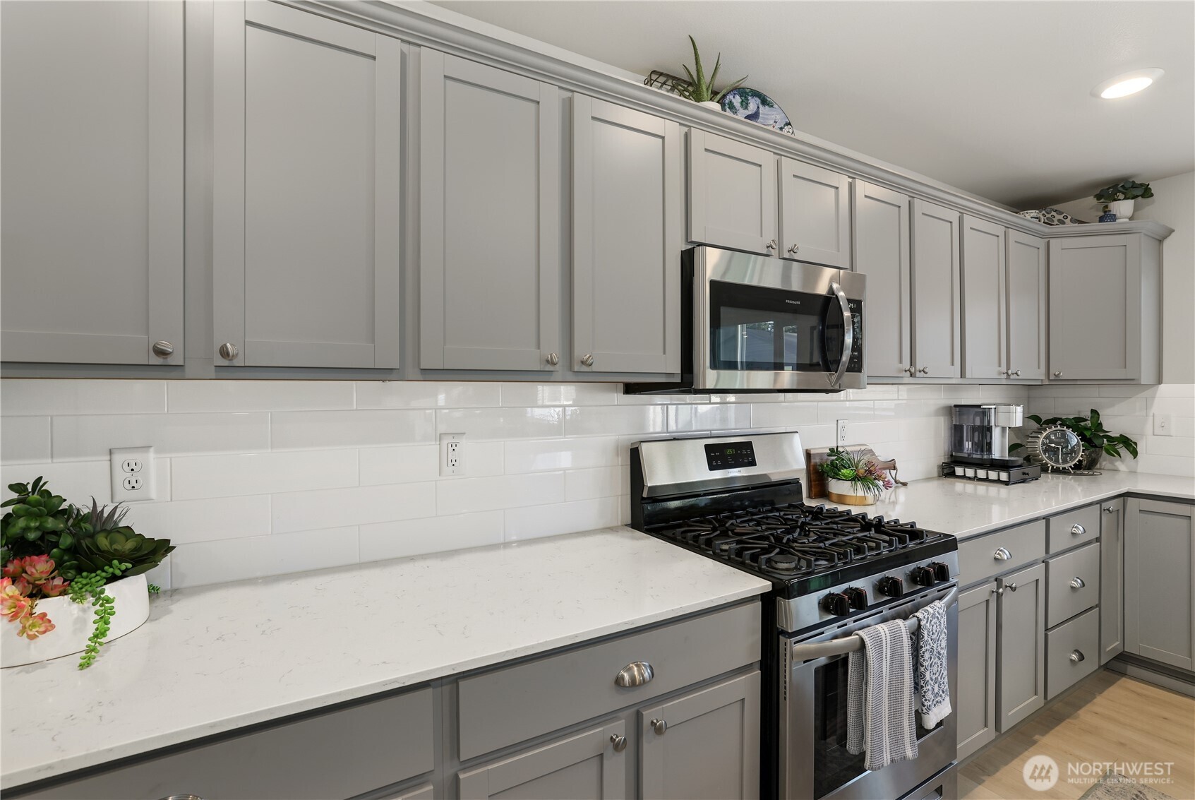 19908 135th Avenue East Graham, WA 98338 - Photo 12 of 39 a kitchen with appliances a sink and cabinets