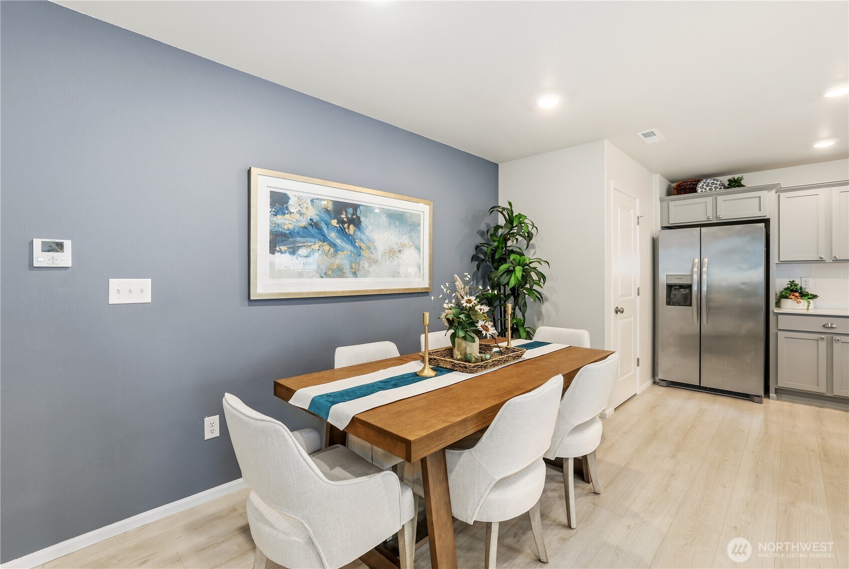 19908 135th Avenue East Graham, WA 98338 - Photo 18 of 39 a dining room with furniture and a kitchen view