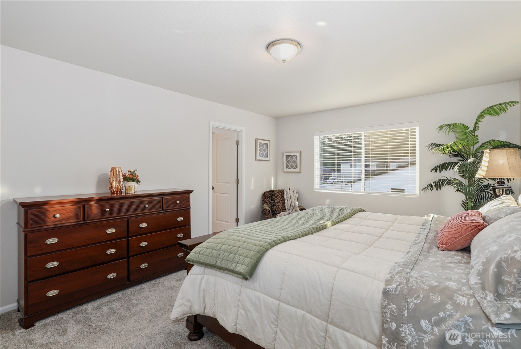 19908 135th Avenue East Graham, WA 98338 - Photo 2 of 39 a bedroom with a bed and a window