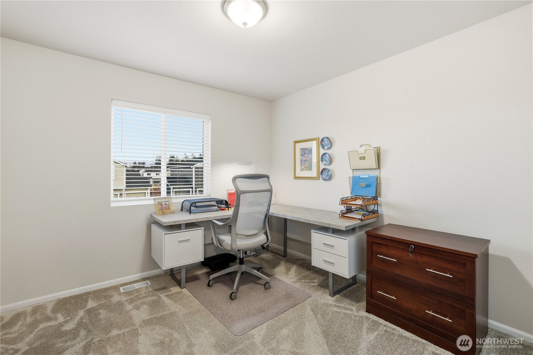 19908 135th Avenue East Graham, WA 98338 - Photo 28 of 39 a view of a workspace with furniture and a window