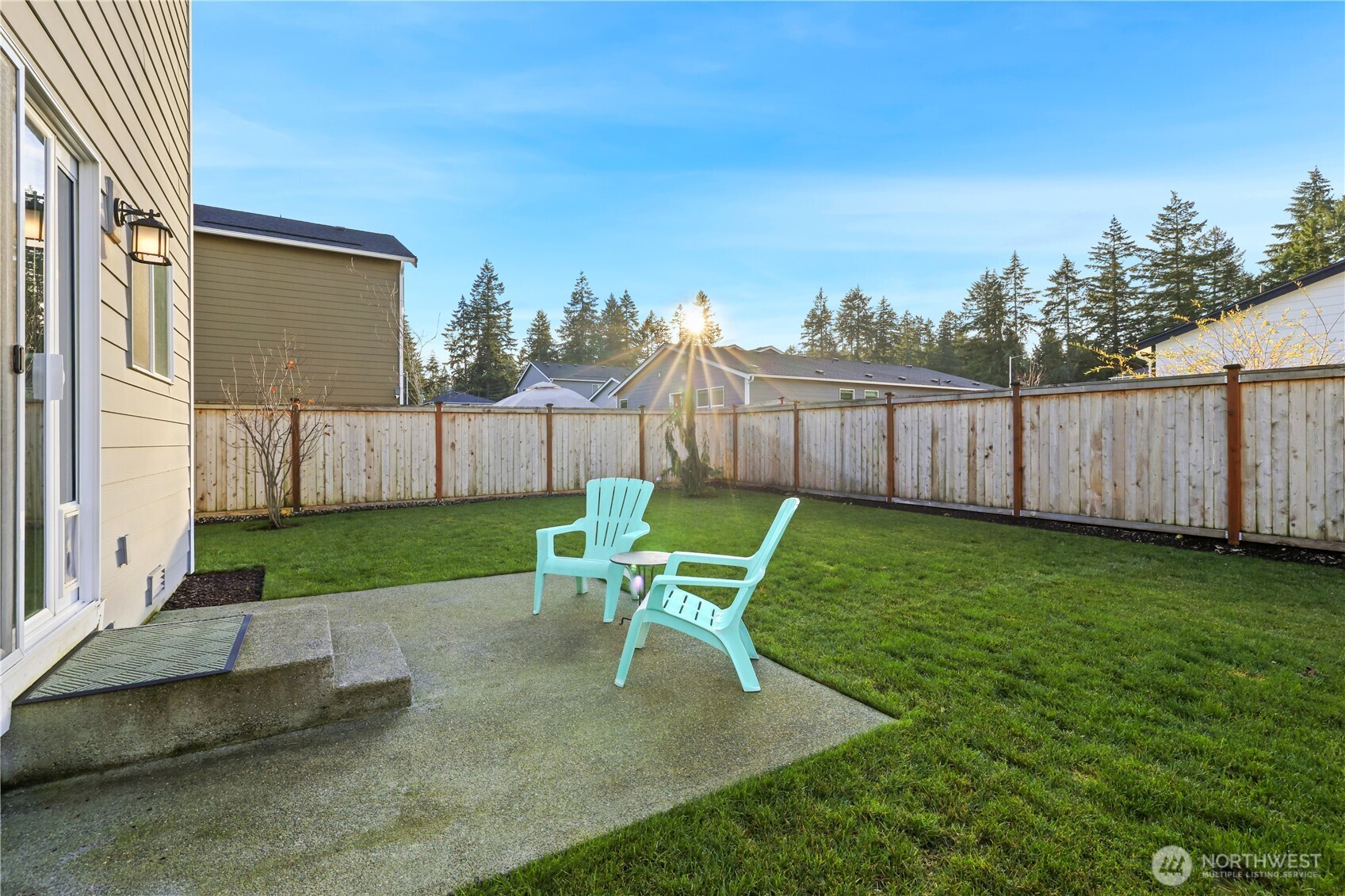 19908 135th Avenue East Graham, WA 98338 - Photo 33 of 39 a view of a chair and table in backyard of the house