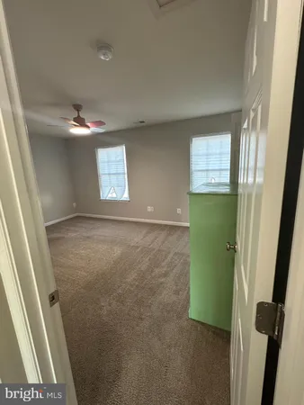a view of room with window and hardwood floor