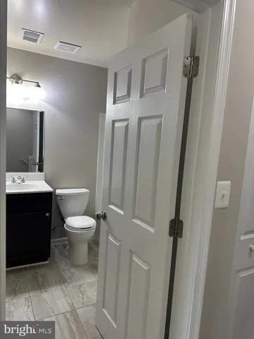 a bathroom with a toilet and a sink