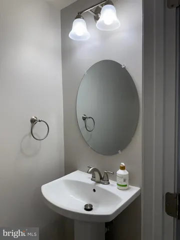a bathroom with a sink and mirror