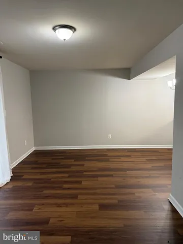 a view of a kitchen counter space with wooden floor