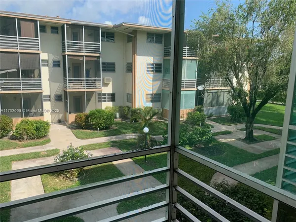 a view of backyard with green space