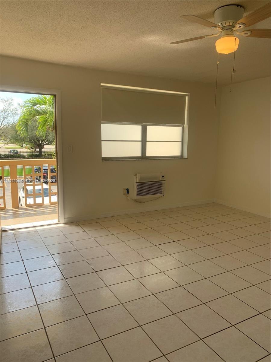 1395 Northeast 167th Street, Unit 209 Miami, FL 33162 - Photo 19 of 28 a view of an empty room and window