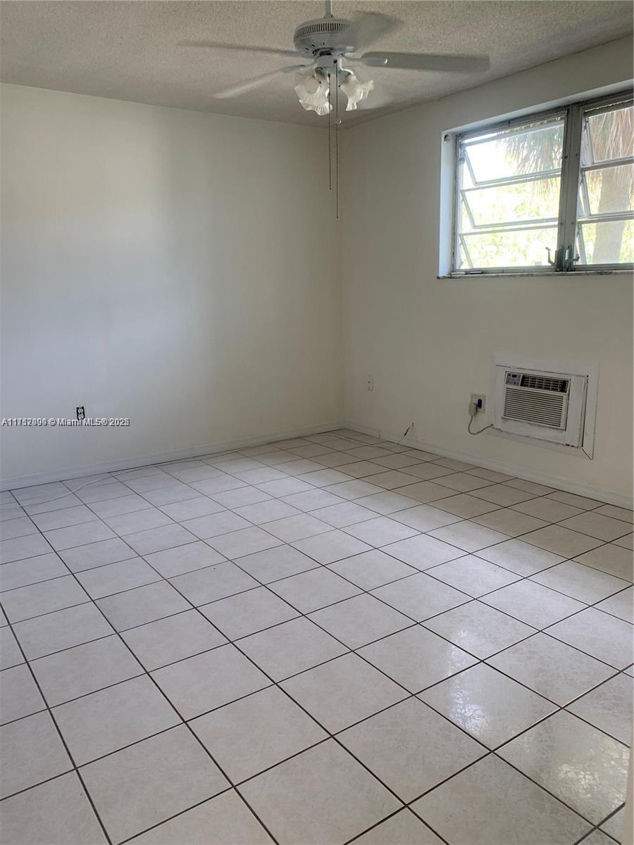 1395 Northeast 167th Street, Unit 209 Miami, FL 33162 - Photo 23 of 28 a view of empty room