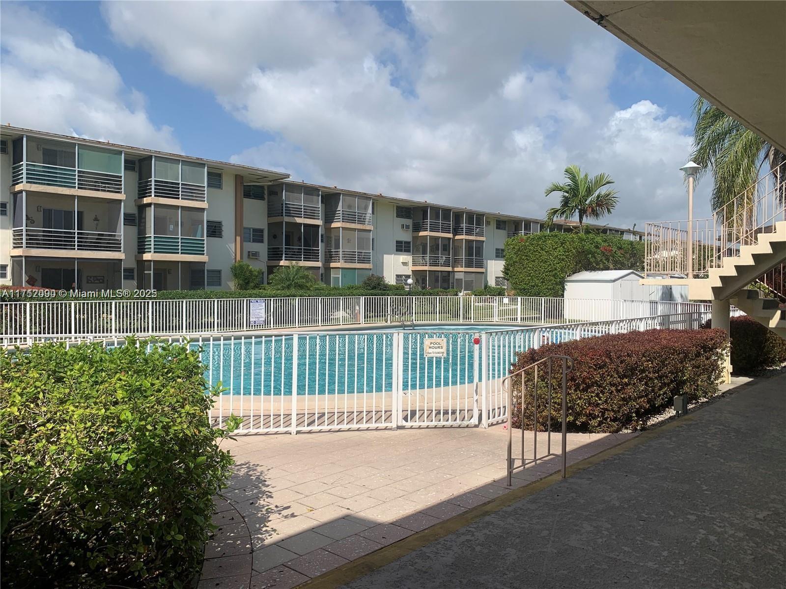1395 Northeast 167th Street, Unit 209 Miami, FL 33162 - Photo 28 of 28 a view of outdoor space and yard