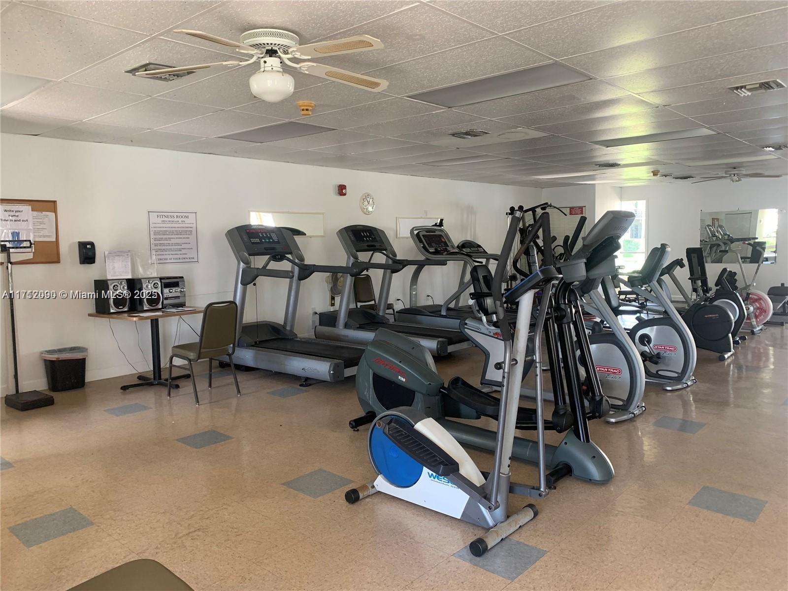 1395 Northeast 167th Street, Unit 209 Miami, FL 33162 - Photo 8 of 28 a view of a room with gym equipment