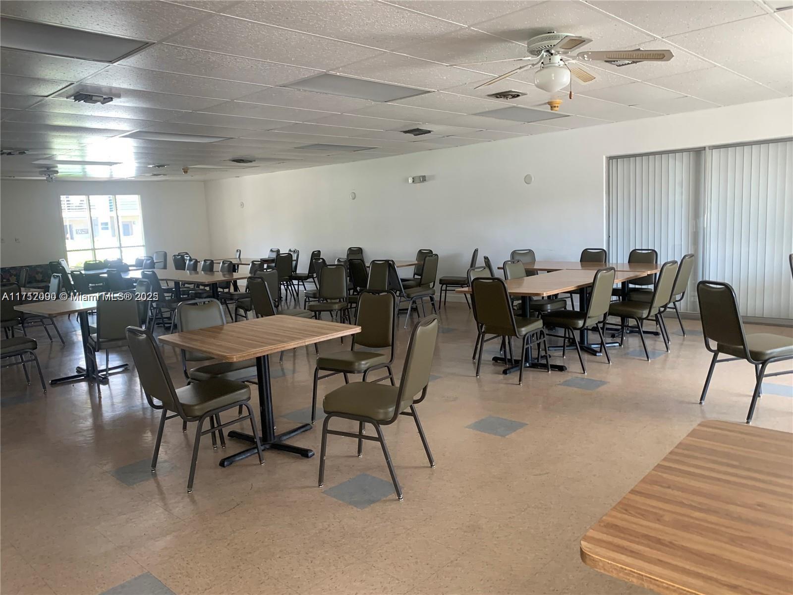 1395 Northeast 167th Street, Unit 209 Miami, FL 33162 - Photo 9 of 28 a view of a dining room with furniture