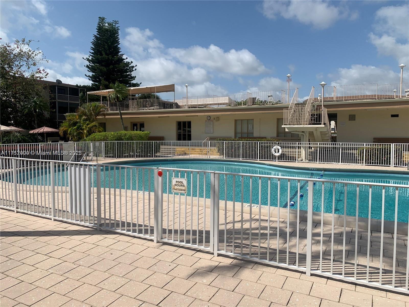 1395 Northeast 167th Street, Unit 209 Miami, FL 33162 - Photo 10 of 28 a view of a building from a terrace