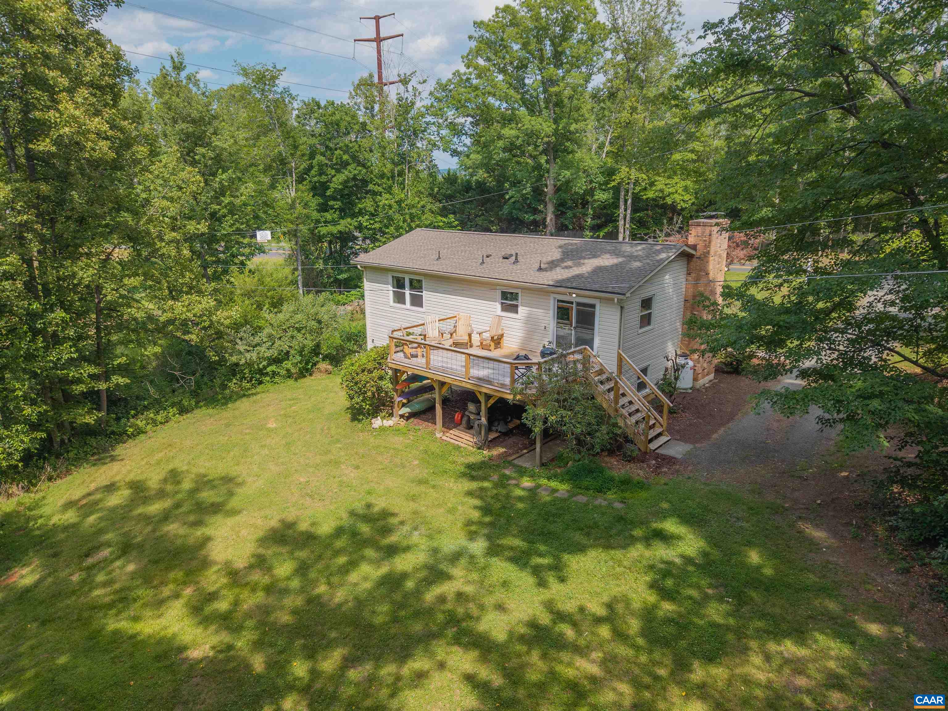 2550 Proffit Road Charlottesville, VA 22911 - Photo 40 of 41 an aerial view of a house with a yard table and chairs