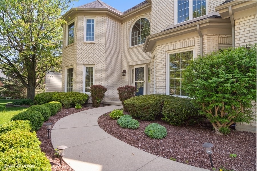 2616 Wendy Road Naperville, IL 60565 - Photo 1 of 29 a front view of a house with a garden