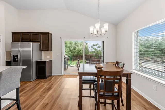 a view of a dining room with furniture window and outside view