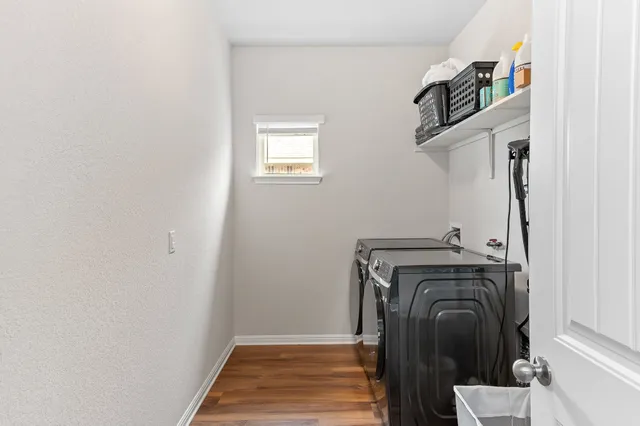 a view of a storage & utility room with a washer dryer