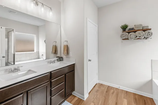 a bathroom with a sink and a mirror