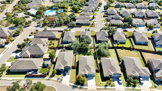 an aerial view of houses with outdoor space