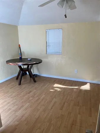 a view of room with a wooden floor