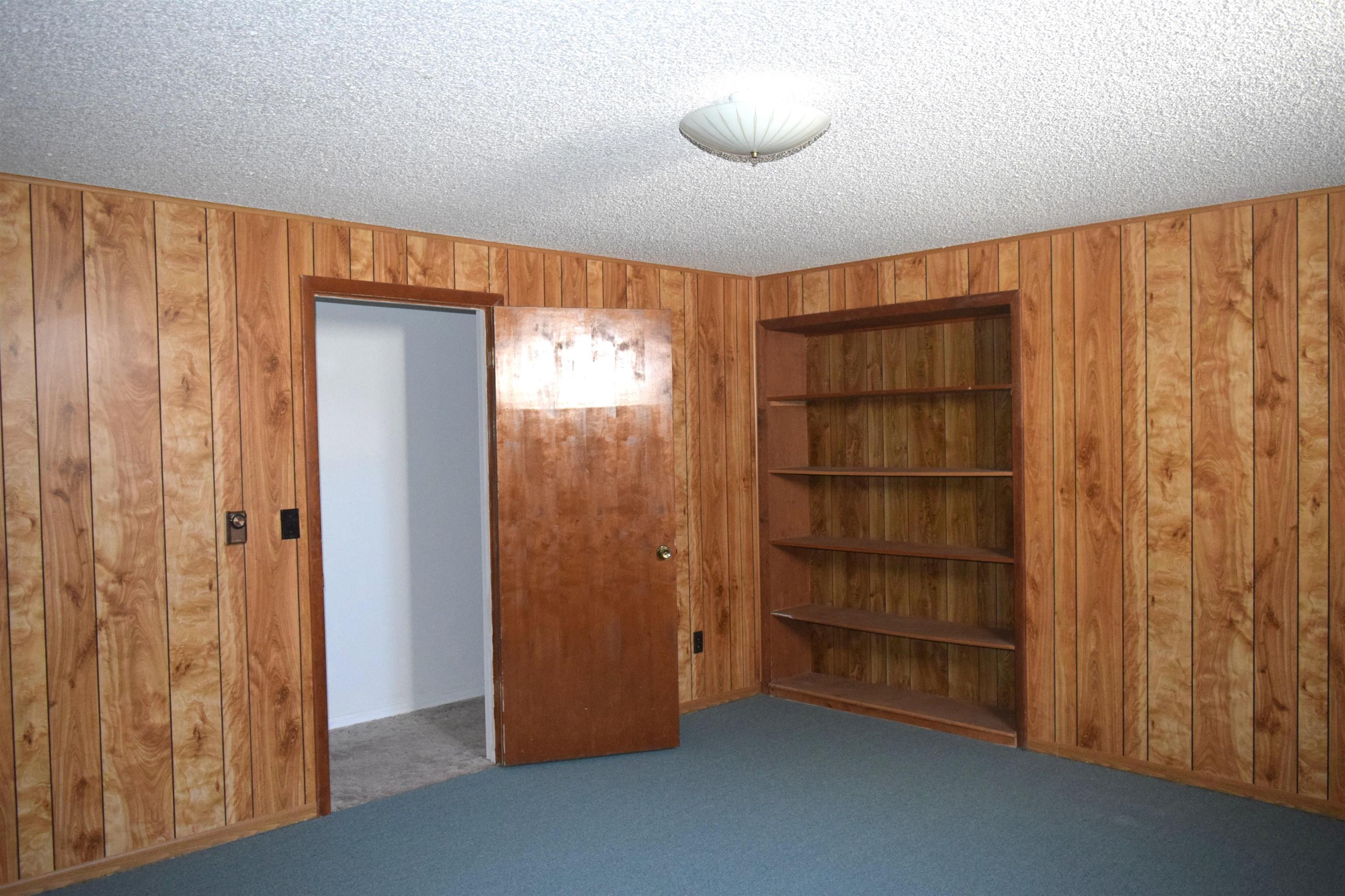 4399 44 Road De Beque, CO 81630 - Photo 16 of 31 a view of an empty room with a cabinet and curtain