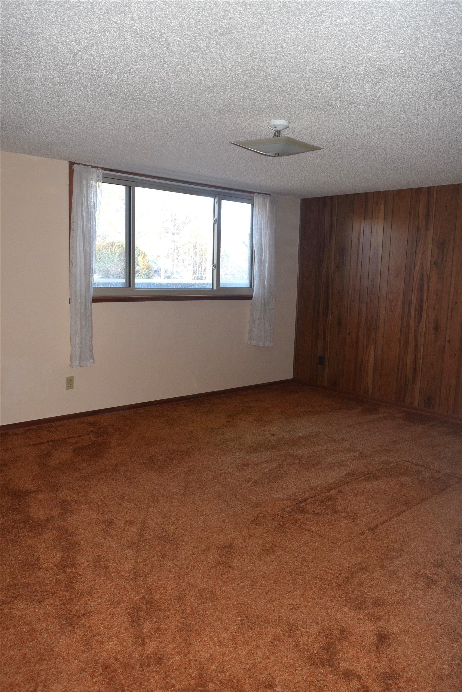 4399 44 Road De Beque, CO 81630 - Photo 17 of 31 an empty room with wooden floor and windows