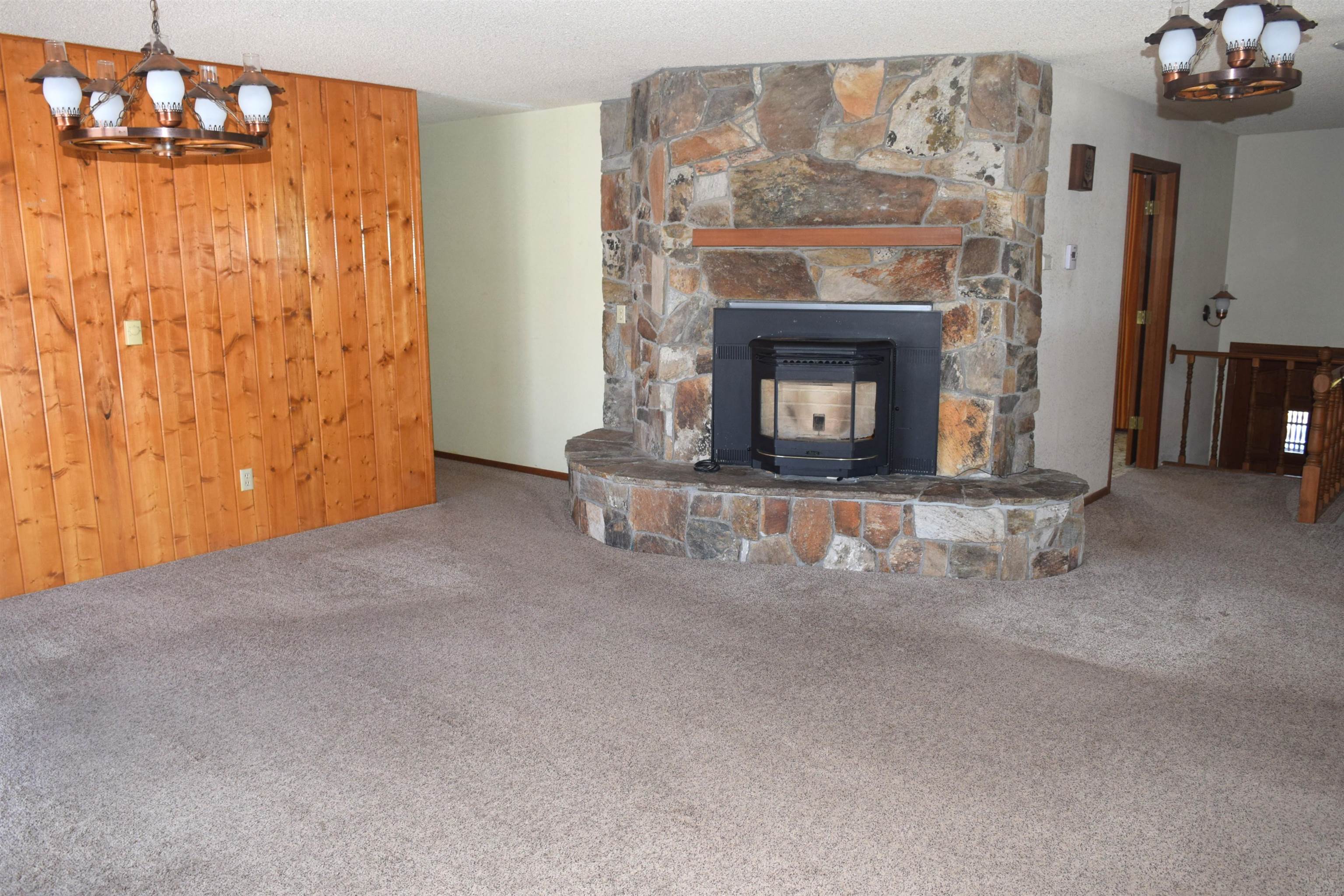 4399 44 Road De Beque, CO 81630 - Photo 3 of 31 a living room with furniture and a fireplace