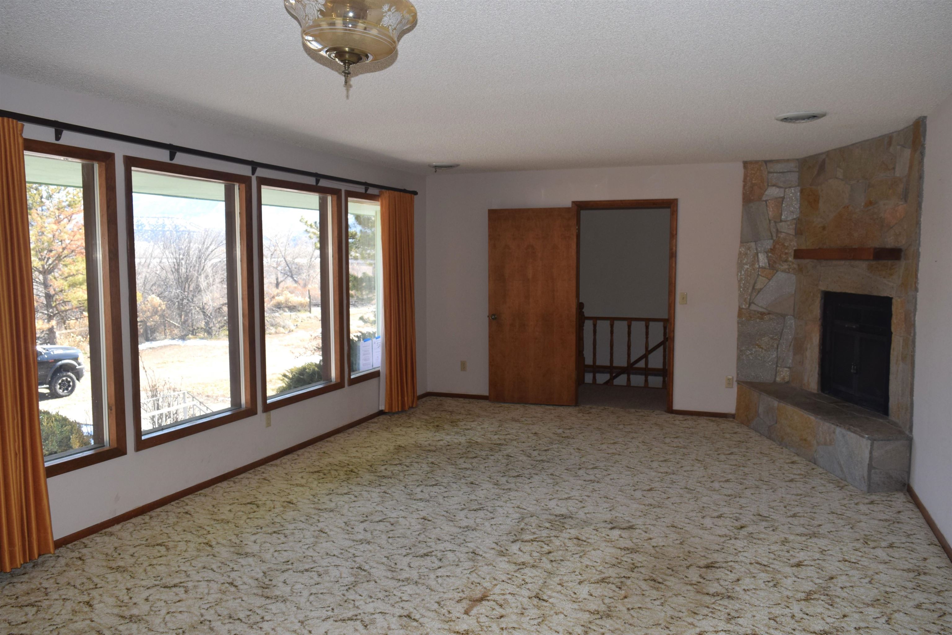 4399 44 Road De Beque, CO 81630 - Photo 8 of 31 a view of empty room with fireplace