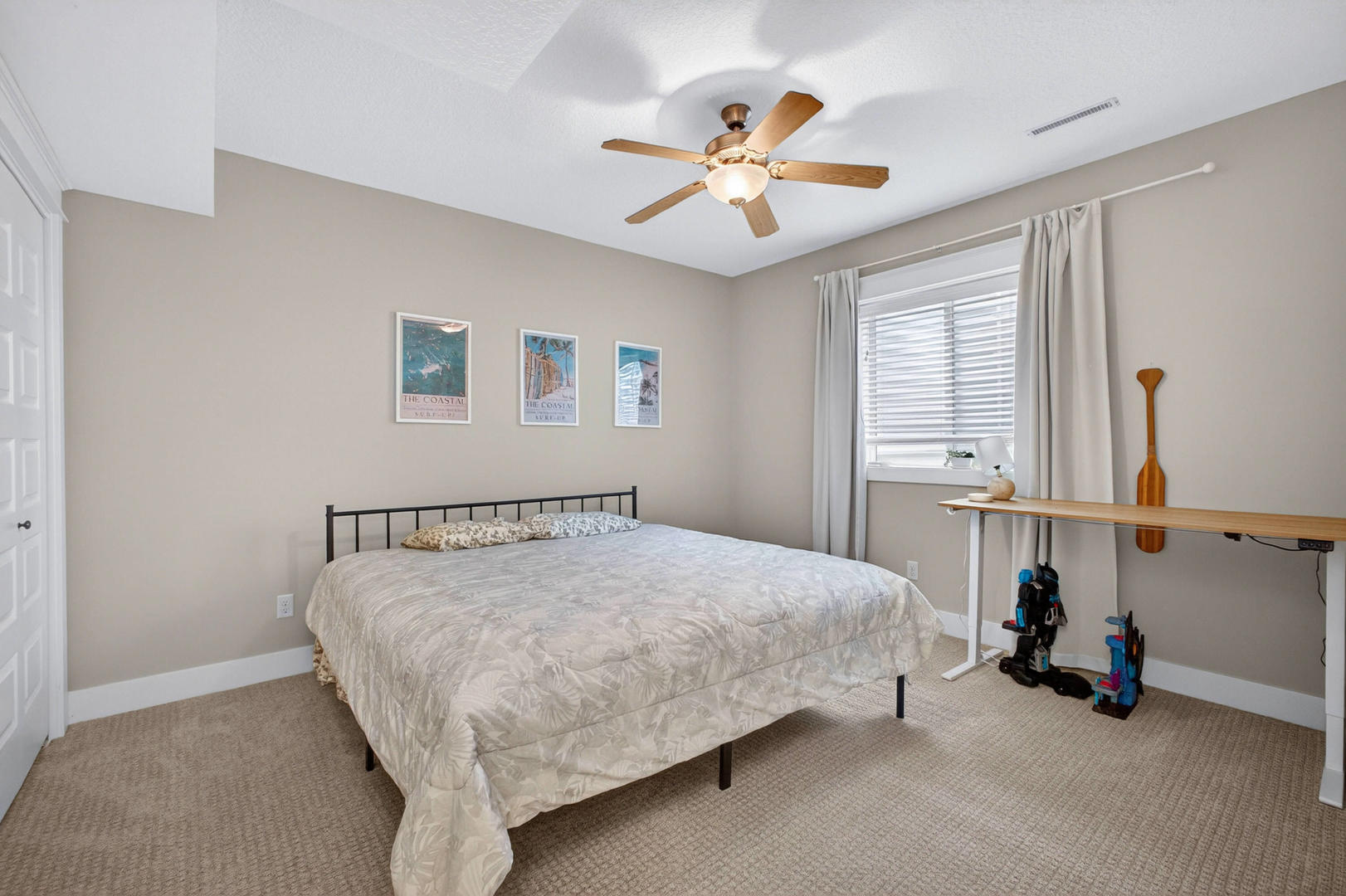 5700 Emily Road Bettendorf, IA 52722 - Photo 44 of 58 a bedroom with a bed and a chandelier