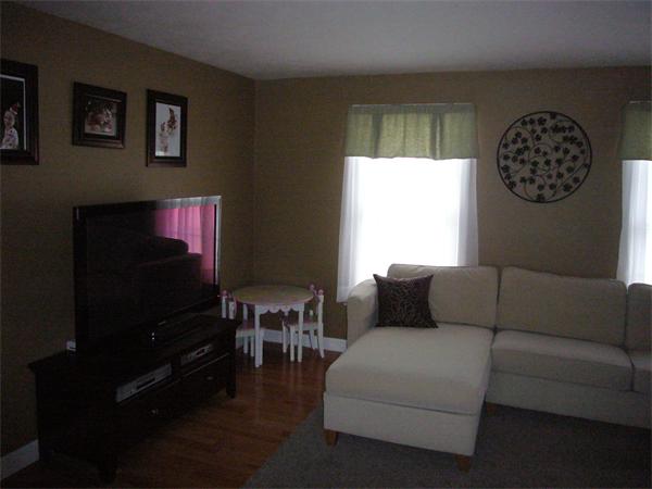 32 Stonegate Road Chelmsford, MA 01824 - Photo 7 of 20 a living room with furniture a flat screen tv and a window