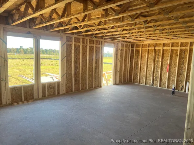 a view of a room with large windows