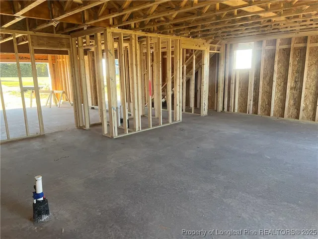 a view of a room with stairs and a window