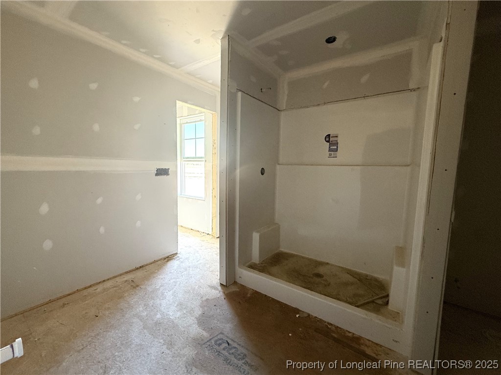188 Buggy Top Lane Autryville, NC 28318 - Photo 10 of 12 a bathroom with a glass shower door