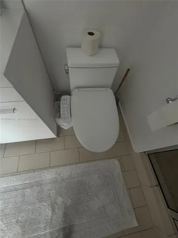 a view of a patio with couches table and chairs and potted plants