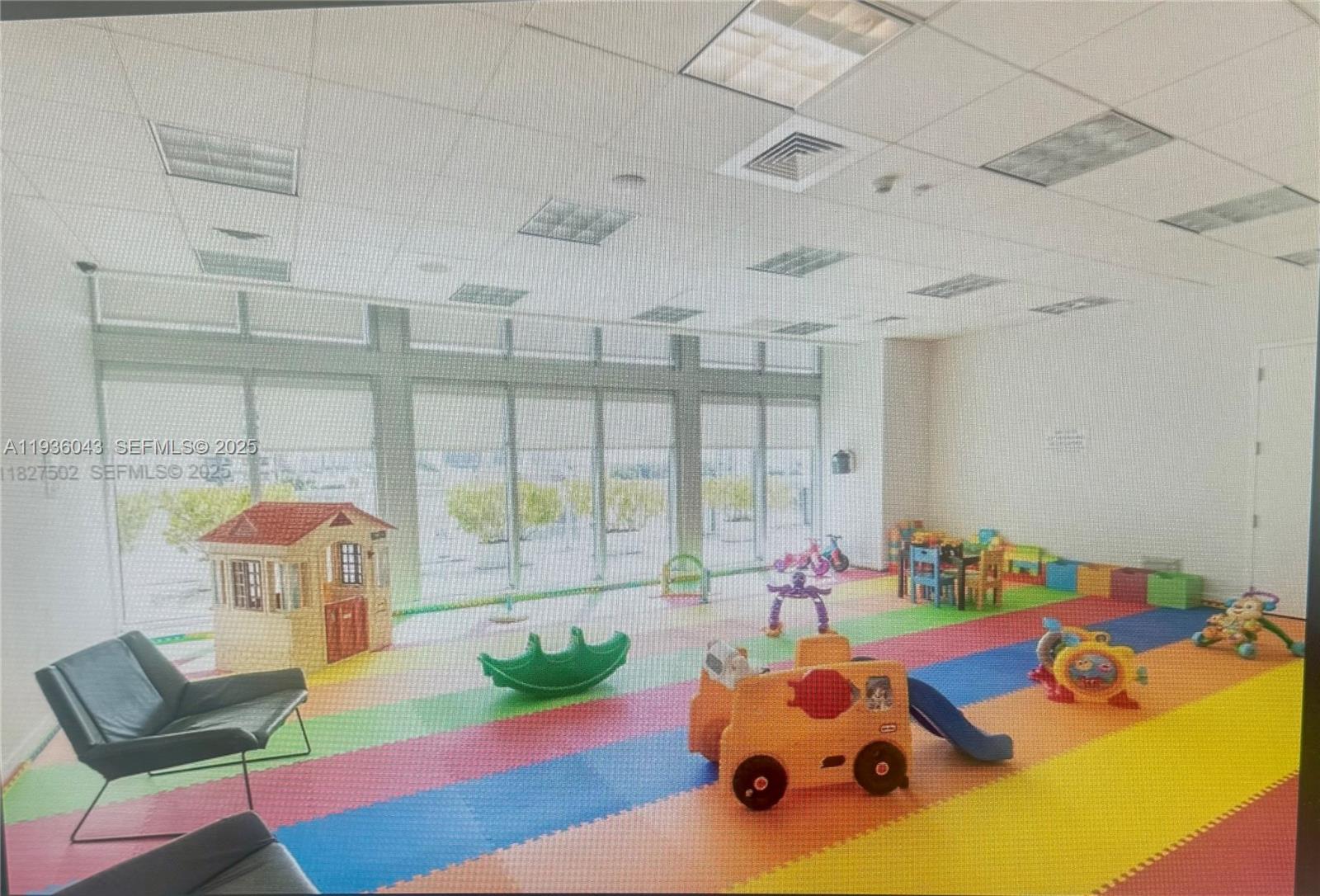 1111 Southwest 1st Street, Unit 2616 Miami, FL 33130 - Photo 23 of 27 a bedroom with furniture and a large window