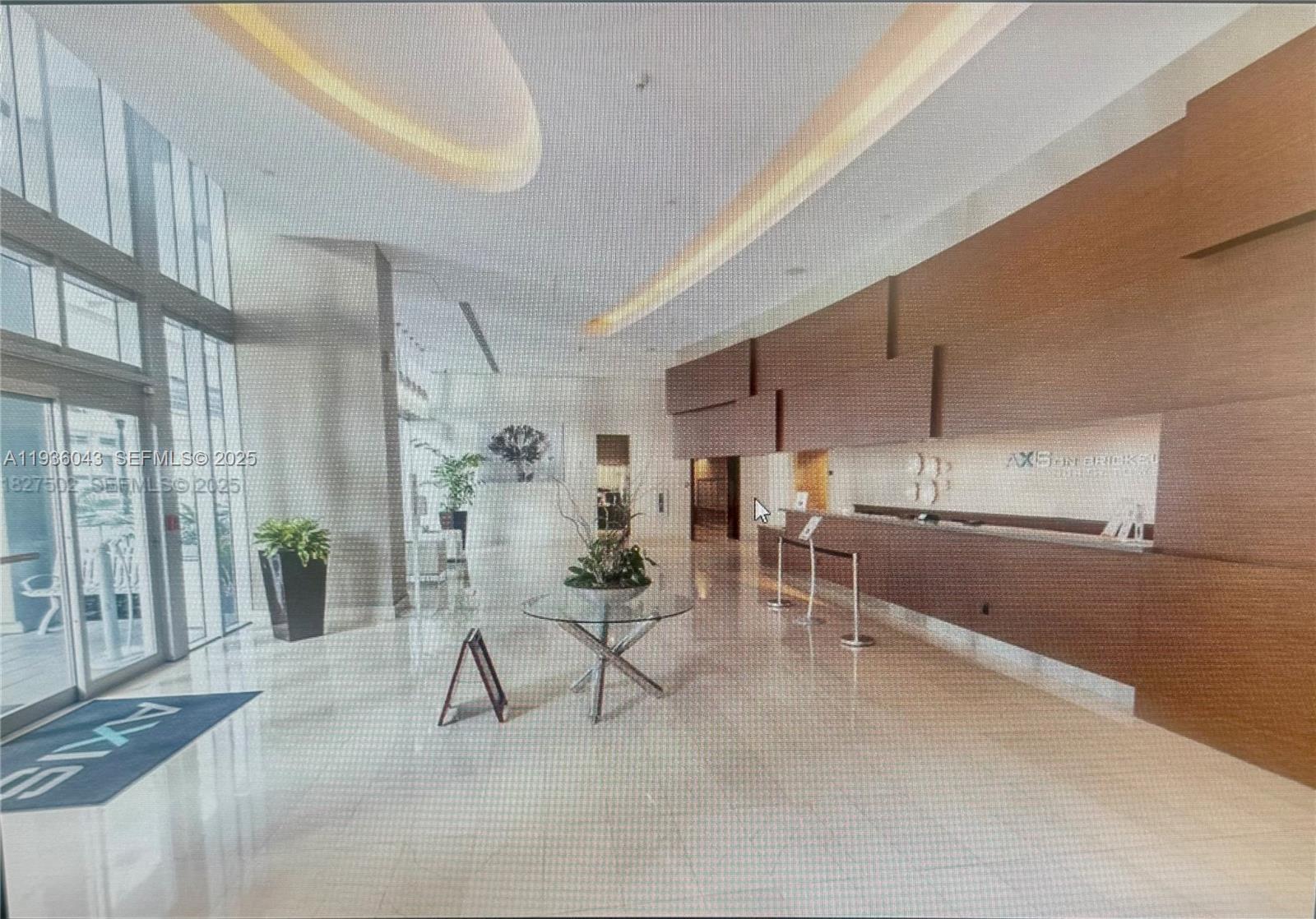 1111 Southwest 1st Street, Unit 2616 Miami, FL 33130 - Photo 4 of 27 a living room with furniture and a table