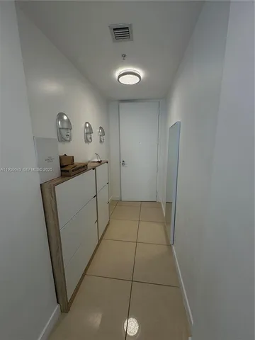 a kitchen with stainless steel appliances a refrigerator and a stove top oven