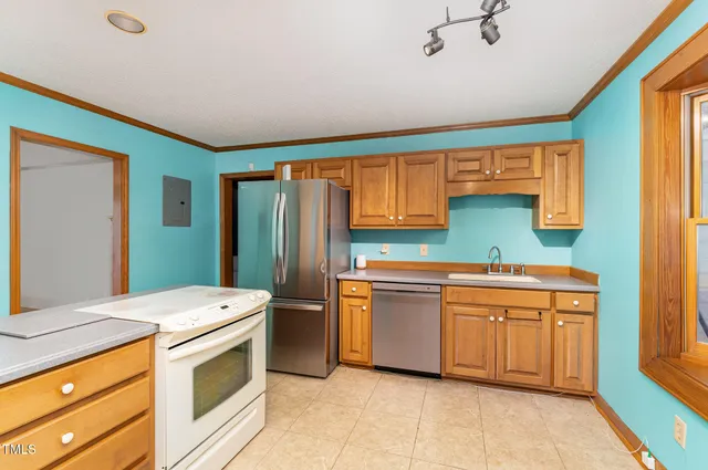 a room with cabinets and washer dryer
