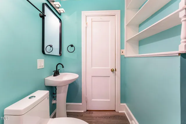 a view of a room with wooden floor