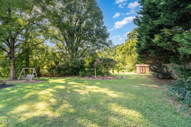 a view of a park with a tree